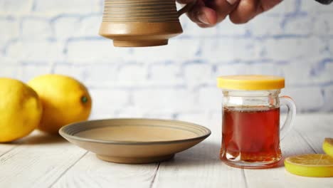 Close-up-of-dry-lemon,-ginger-and-green-tea-on-table