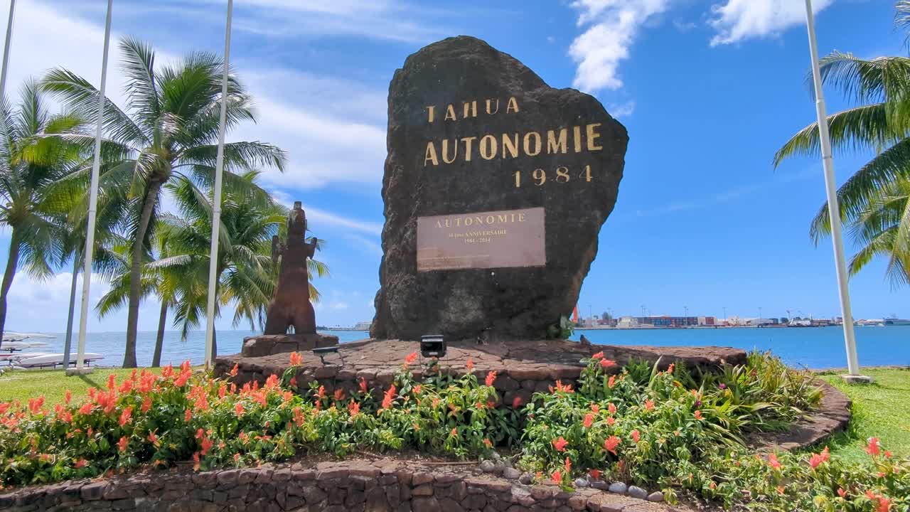 Internal autonomy memorial with French Polynesia and France flags in Papeete Tahiti capital city of French Polynesia, South Pacific
