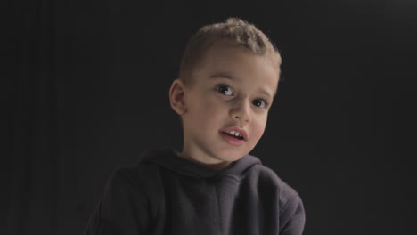 young baby boy smiling and showing different facial reactions to the camera while doing a film casting and camera test shot on 4k