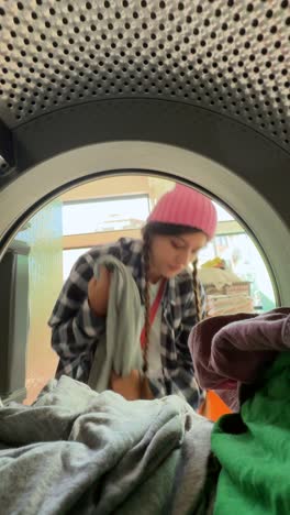 teenage girl doing laundry