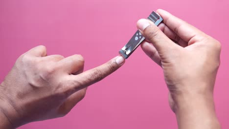 person using nail clippers