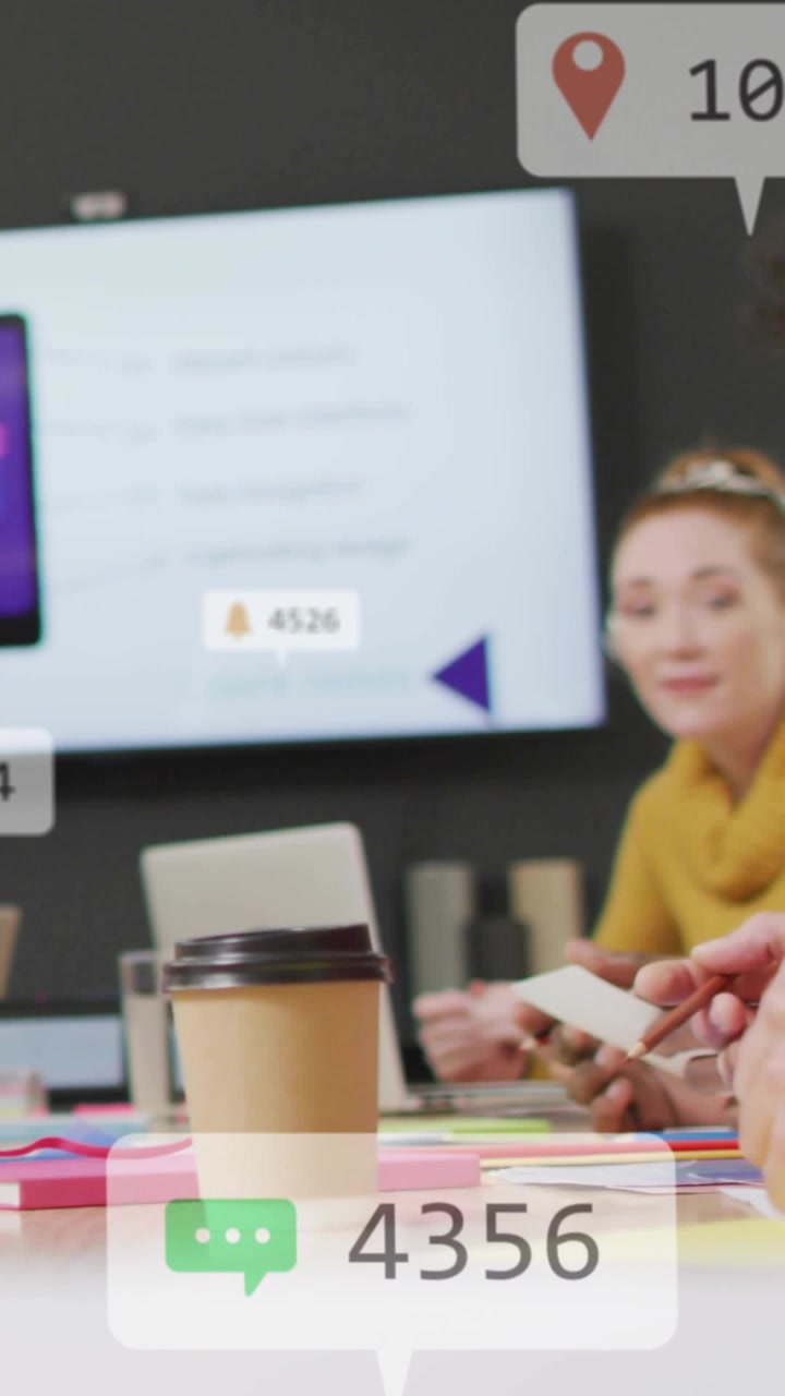 Vertical video: Team tapping cup causing animated metrics rising and falling for business tracking