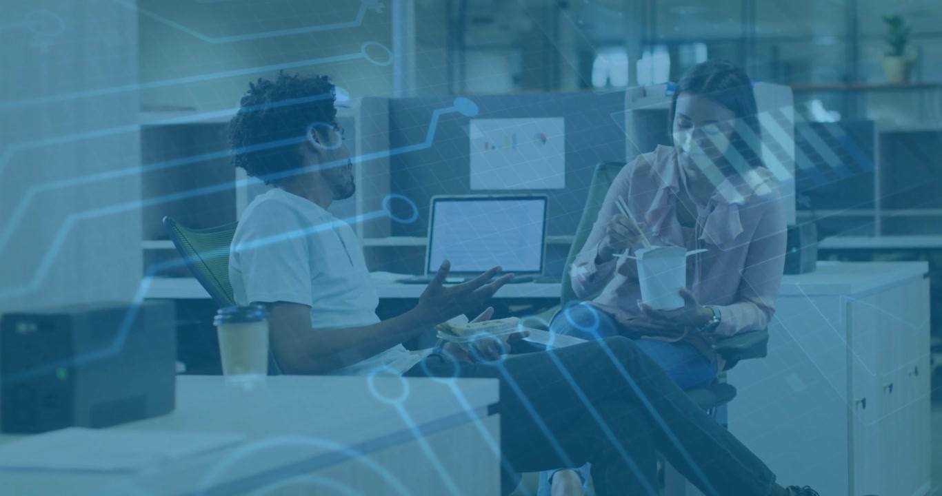 Man gesturing and woman eating noodles in office causing pulsing circuitry overlay for tech demo