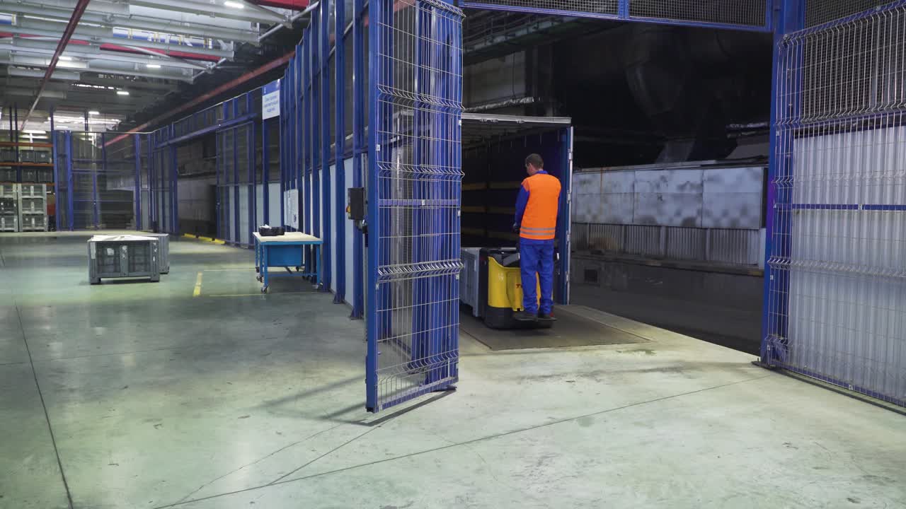 Worker operating a forklift inside a factory