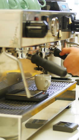 man making cup of coffee