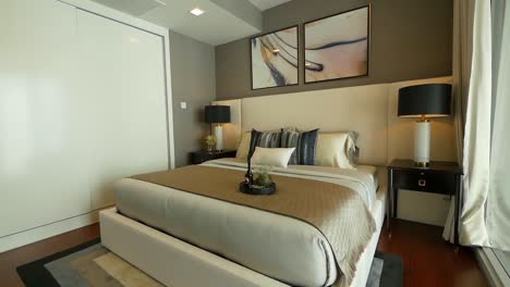 bedroom furnished with the stylish bedding, couch and lighting furnitures