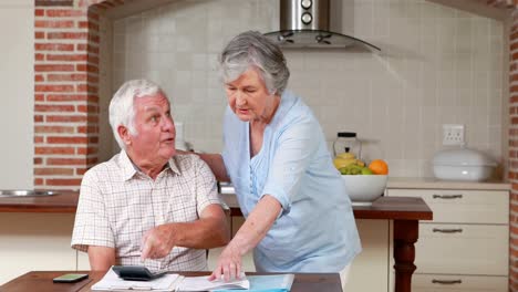 Senior-couple-paying-their-bills