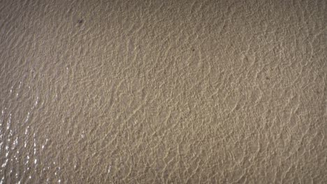 excellent aerial shot of the muddy waters of the reef in molokai, hawaii