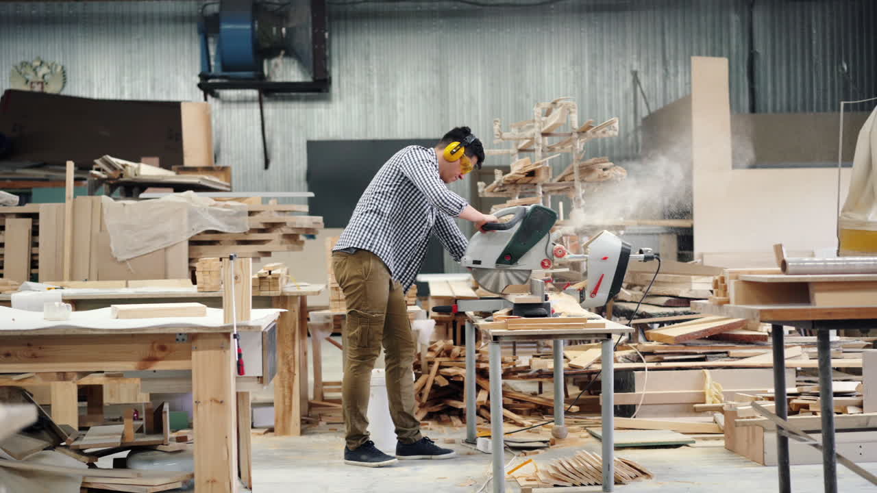 Woodworker using Circular Saw in Workshop
