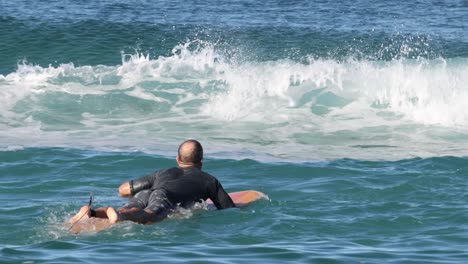 a surfer navigates through ocean waves sequentially