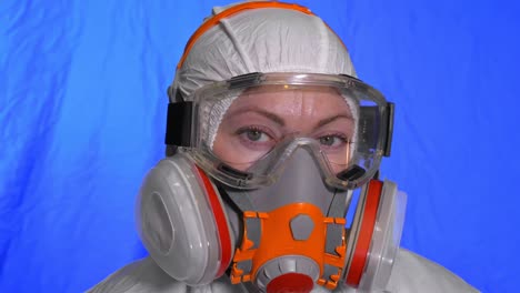 scientist virologist in respirator. woman close up look, wearing protective medical mask. concept health safety n1h1 coronavirus epidemic 2019 ncov.