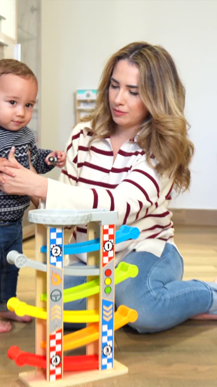 Mother and child playing with a ramp racer toy