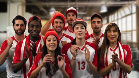 group of sports fans cheering in a gym 4k