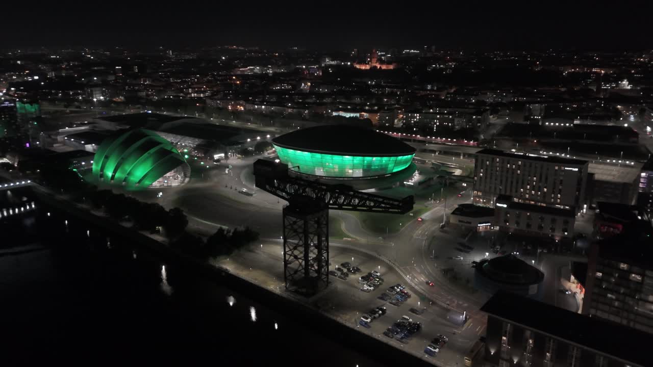 Aerial Night View of Glasgow's Illuminated OVO Hydro and SEC Armadillo with Finnieston Crane