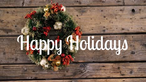 happy holidays text and christmas wreath