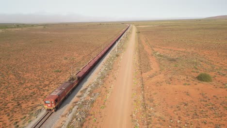 aerial tracking shot of sishen-saldanha iron-ore train on its way to saldanha, south africa