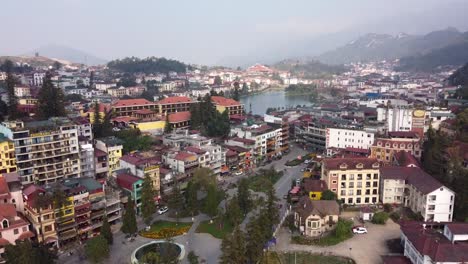 aerial view of sapa cityscape, tranquil scenery with sapa lake in background, vietnam
