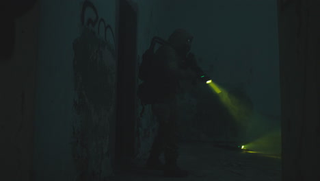 a wounded soldier in the abandoned military complex during the recon mission