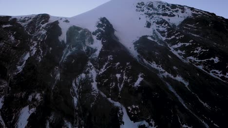 Drone-view-of-a-foggy-morning-at-pico-de-orizaba-landscape-and-view-of-the-glacier-and-summit-of-the-Citlaltepetl-volcano,-Mexico