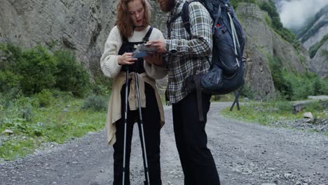 hikers consulting a map in the mountains