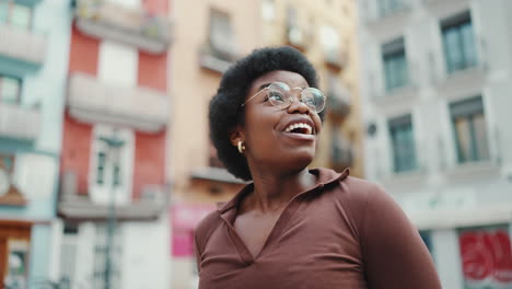 surprised african girl looking happy exploring new city alone