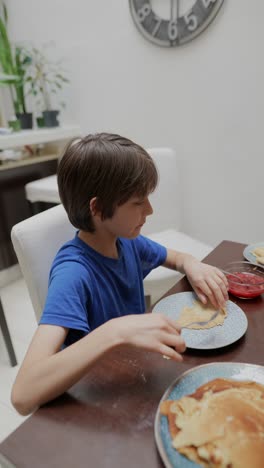 boy eating pancakes