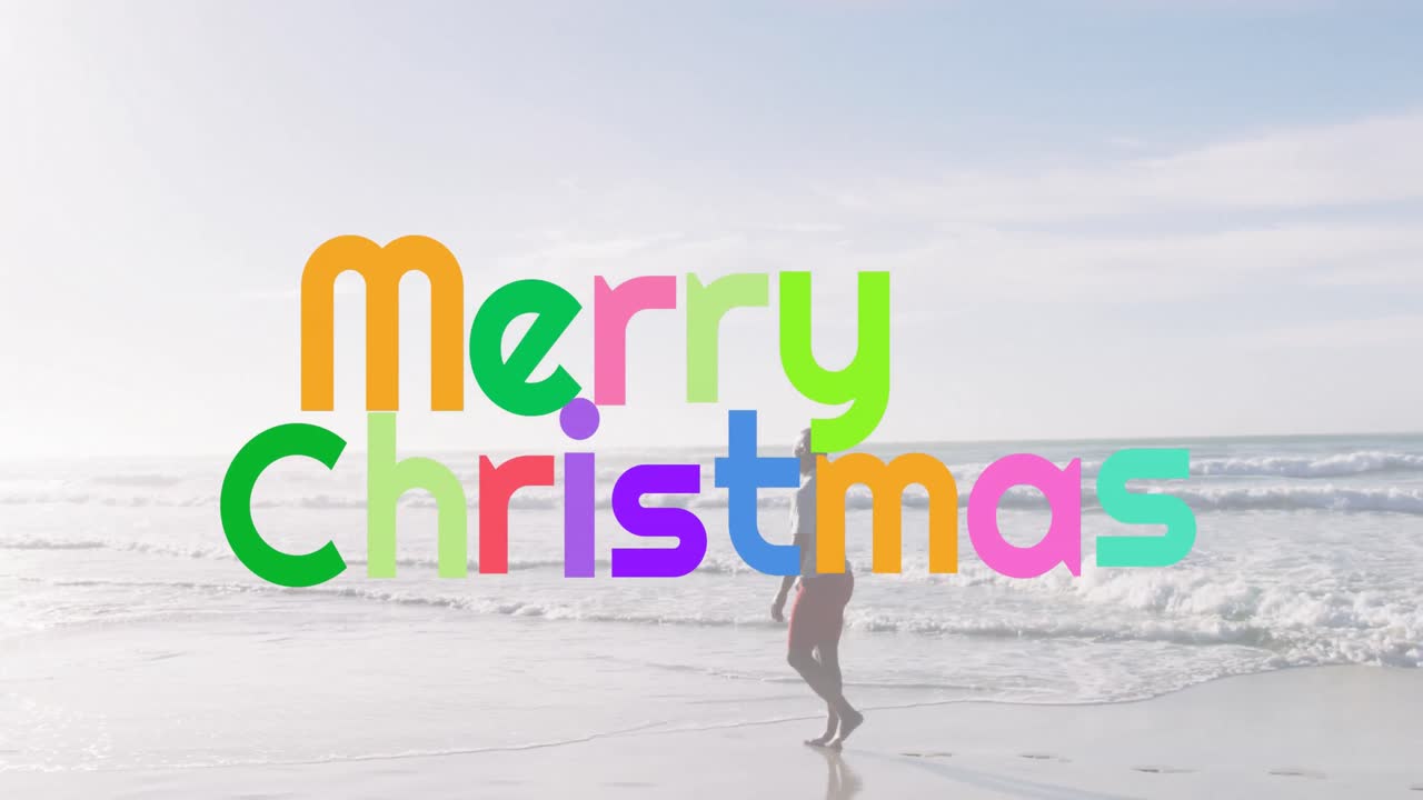 Animation of merry christmas over african american senior man on beach