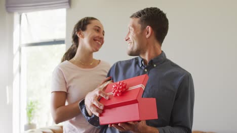 happy young caucasian couple in love spending valentines day at home