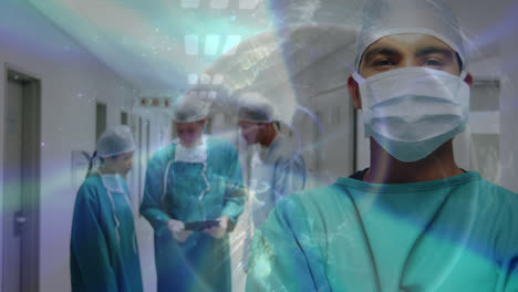 Animation-of-globe-over-diverse-surgeons-with-face-masks