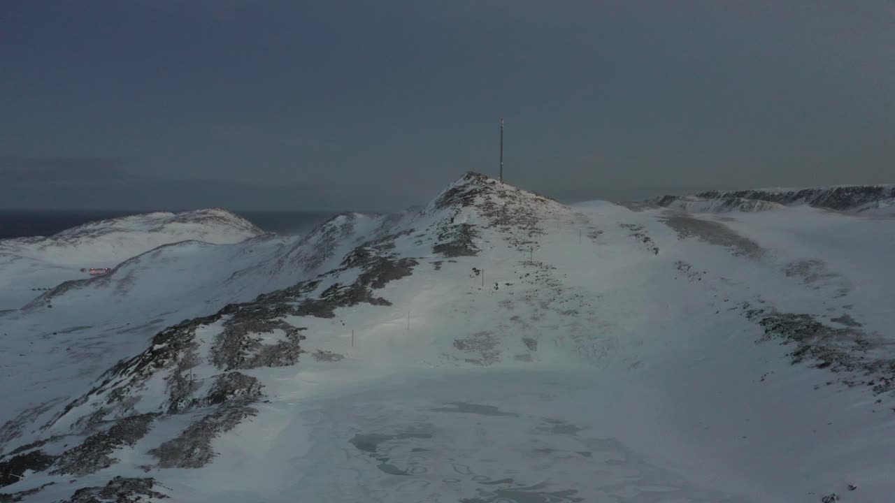 Shot of the no mans land in Northern Europe during winter, showing a windy frozen tundra. Aerial shot.