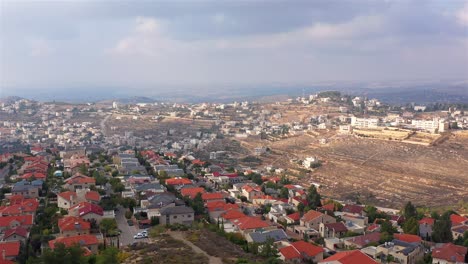 aerial view of a residential town on a hilly landscape