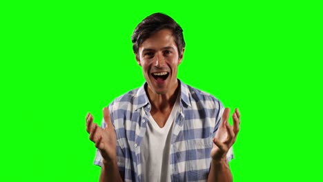 front view of caucasian man surprising with green screen