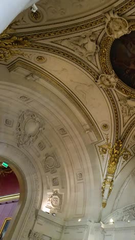 Visitors admire ornate ceilings and grand architecture