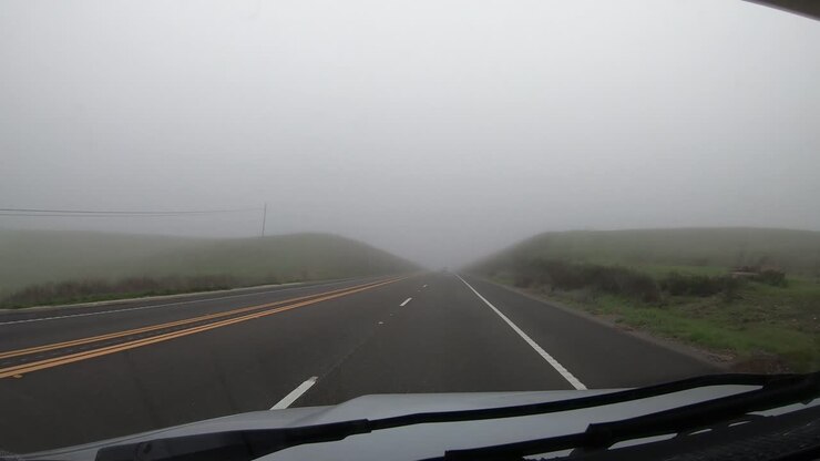 Time lapse hyperlapse driving through thick fog in California hills in Los Padres National Forest