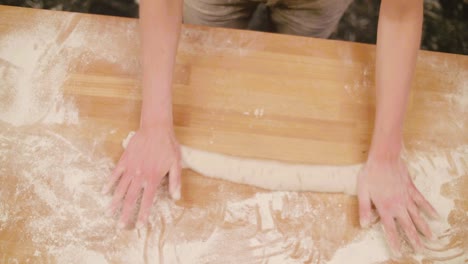 bakery baguette dough being rolled