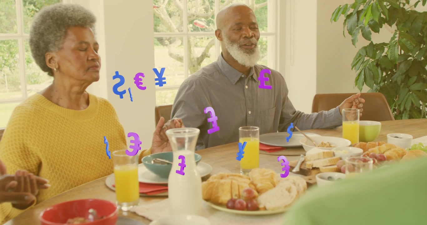 Family holding hands on table, invoking animated currency symbols rising over financial breakfast