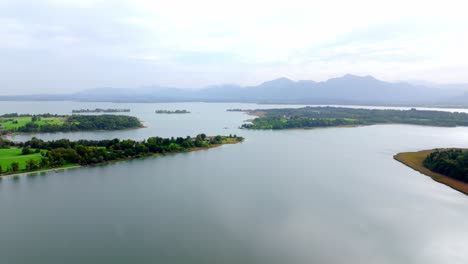 chiemsee lake with tranquil waters in bavaria, germany - aerial drone shot
