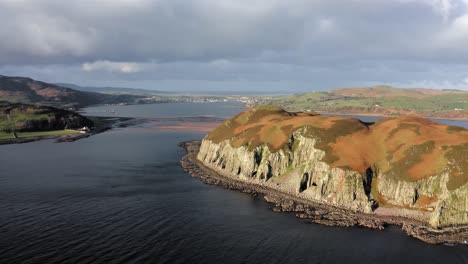 AERIAL---Epic-shot-of-Island-Davaar,-a-tidal-island-in-Kintyre,-Scotland,-forward