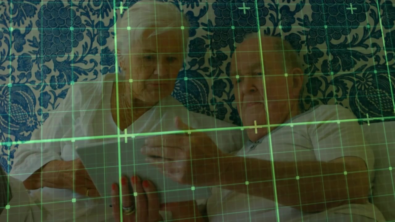 Animation of shapes moving over senior caucasian couple using tablet