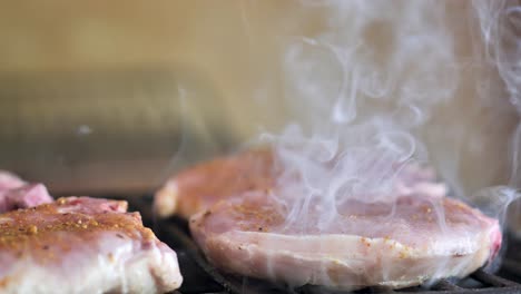 A-steak-of-meat-is-cooking-on-a-grill-close-up