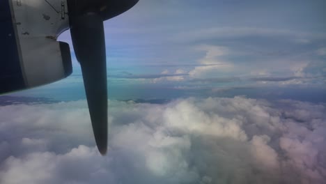 view from a plane - prppeller and clouds over the pacific ocean and the solomon islands