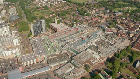 Circling-aerial-shot-over-Basingstoke-central-mall-with-parking-lots-on-top
