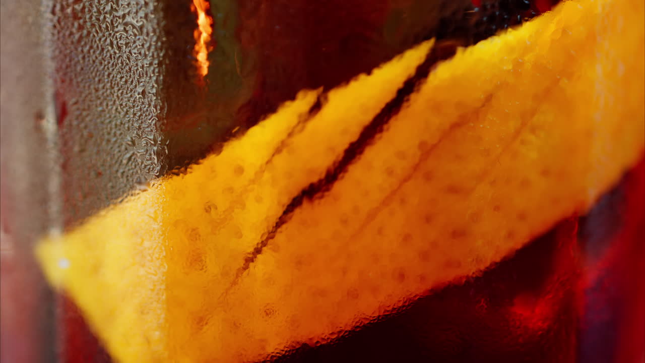 Close up of a Negroni cocktail on a table at a terrace
