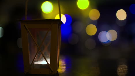 outdoor lantern with lit candle