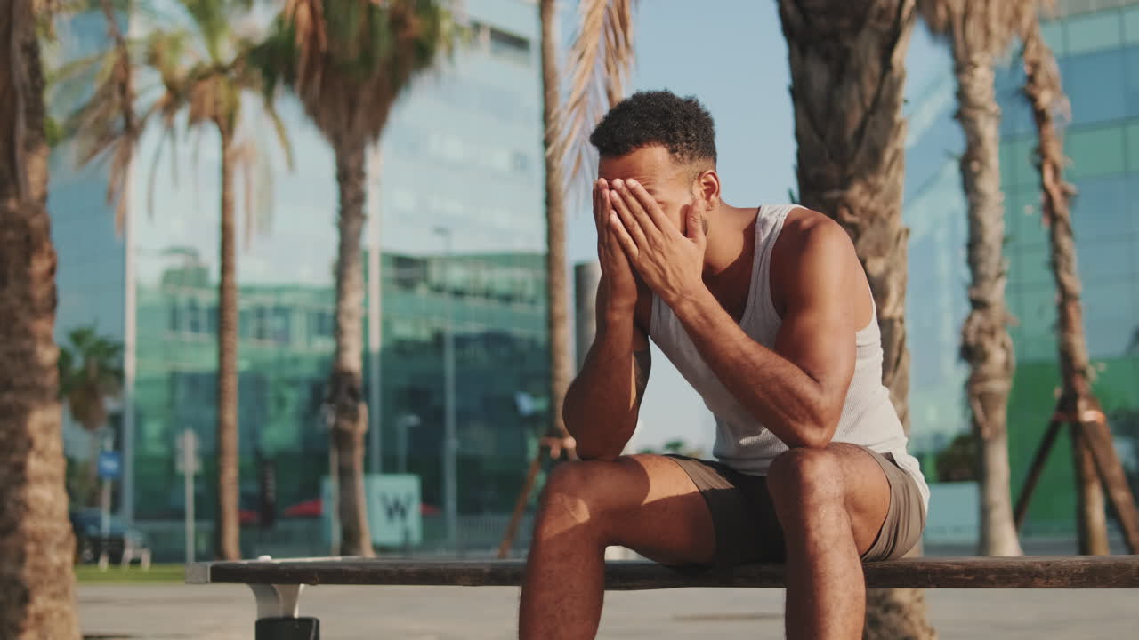 Man resting on a bench outdoors