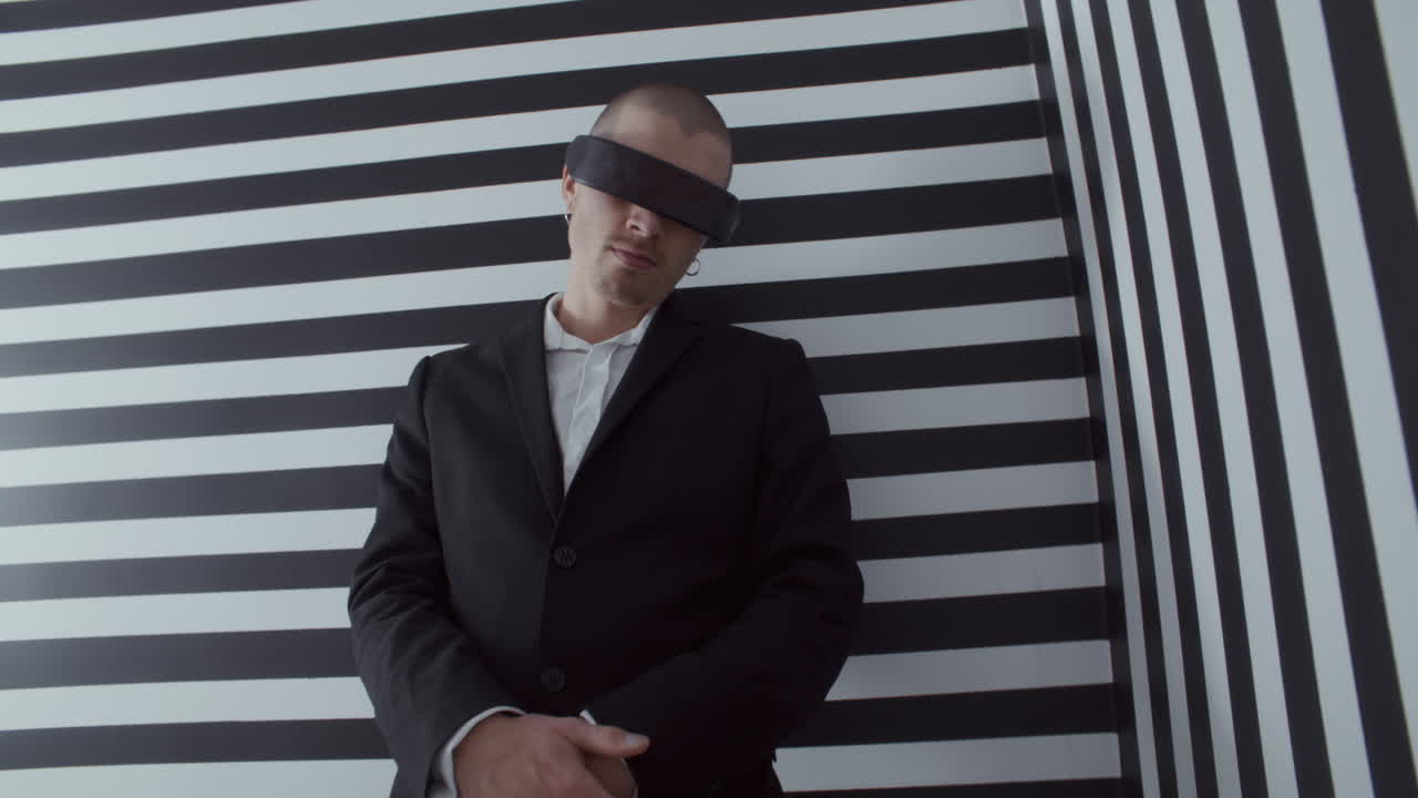 Man Wearing VR Headset in Striped Background