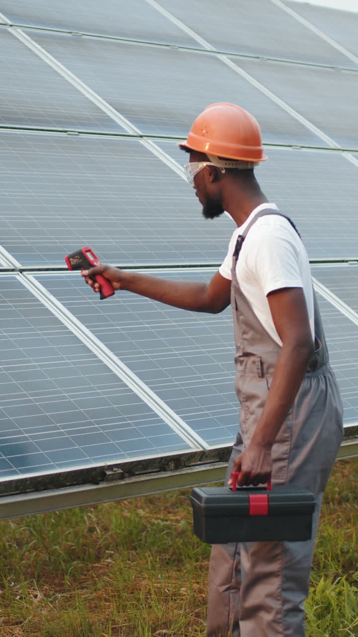Solar panel technician inspecting