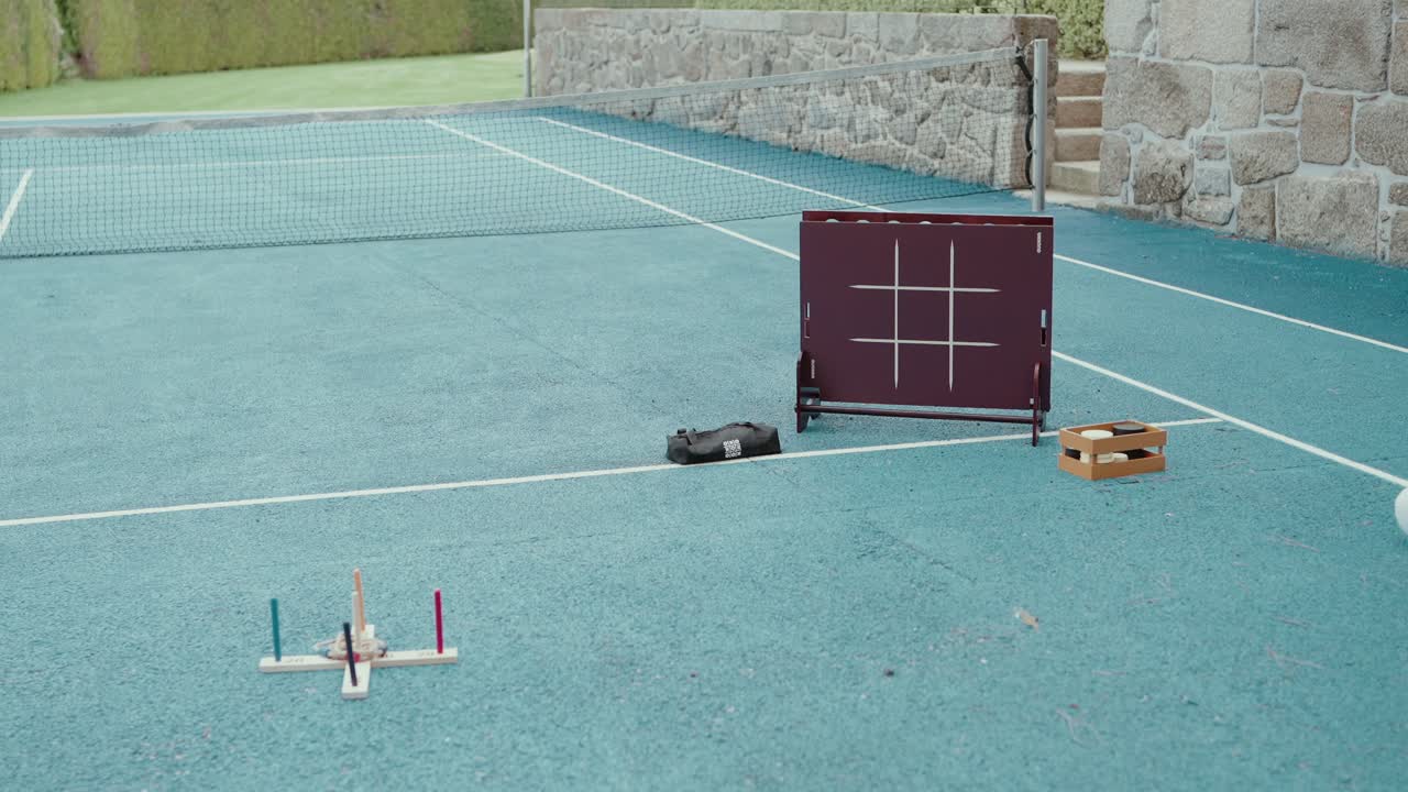 game of tic tac toe arranged casually on blue sports court