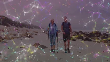 caucasian senior couple hiking in countryside, over colourful moving network of connections