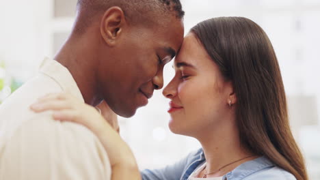 Hug,-happy-and-an-interracial-couple-in-an-embrace